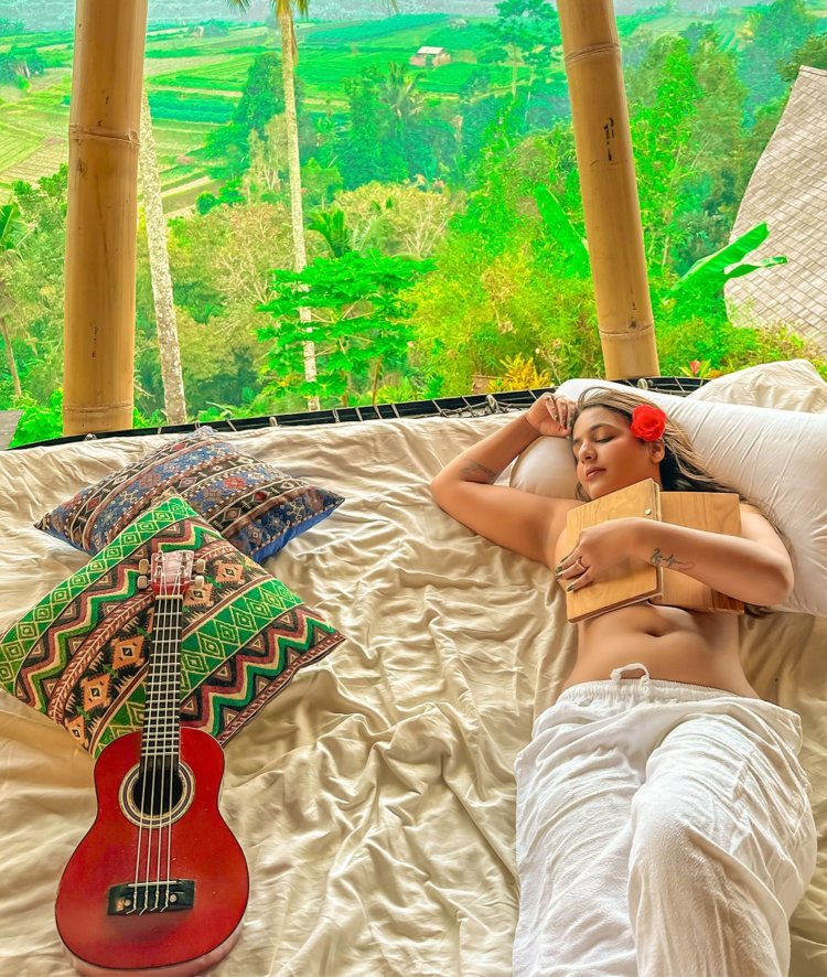 Shreyal Pandey lying on the bed & carrying a Book