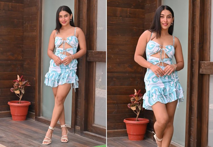Akriti Negi wearing a blue and white dress in a professional shoot